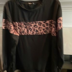 Black cotton top with leopard trim. Long sleeve. Trim across front